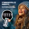 A young girl looking up at a string of icicle lights, with a remote control shown in the foreground. Náhled obrázku produktu