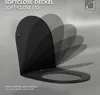 A black toilet seat lid is shown in various stages of closing, illustrating its soft-close feature. Podgląd zdjęcia produktu