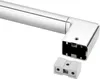 A close-up view of a chrome-plated corner piece of a towel holder, with a separate plastic connector piece in the foreground. Produktbild-Vorschau