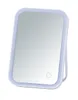 A white LED makeup mirror with a stand. Produktbild-Vorschau