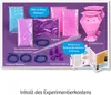 A flat lay image showcasing the contents of a KOSMOS Glitzer-Diamanten experiment kit against a purple background. Náhľad obrázku produktu