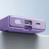 Close-up of the ports and digital display of a purple power bank. Podgląd zdjęcia produktu