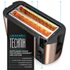 A cutaway diagram of a toaster showing its internal components and features. Voir les images du produit