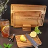 A set of wooden cutting boards with a drink and ingredients for a cocktail. Produktbild-Vorschau
