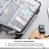 Inside an open suitcase, showing mesh packing cubes filled with items. A camera and notebook are on the bed next to the suitcase. Produktbild-Vorschau