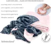A folded blanket with text describing its features. Produktbild-Vorschau