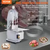 A bone sawing machine with its accessories and raw meat. Podgląd zdjęcia produktu