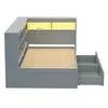 A grey bed frame with built-in shelving and drawers, illuminated by yellow LED lights. Náhľad obrázku produktu