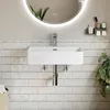 A white rectangular sink mounted on a tiled wall in a bathroom. Anteprima dell’immagine prodotto