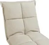 A close-up view of a beige upholstered floor chair. Voir les images du produit
