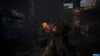 A first-person perspective of a video game scene, showing a weapon aiming at a fiery explosion in a dark, industrial environment. Produktbild-Vorschau