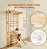 A child is playing on a wooden gym set indoors. Podgląd zdjęcia produktu