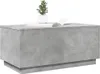 A concrete-effect coffee table with a small potted plant and a book on top. Produktbild-Vorschau