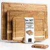 A set of three wooden cutting boards of different sizes, stacked and displayed with a product information card and a small wooden holder. Náhled obrázku produktu
