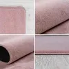 A collage of four close-up images showing different angles and textures of a pink rug. Produktbild-Vorschau