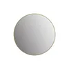 A round mirror with a gold frame on a white background. Anteprima dell’immagine prodotto