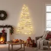 A cozy living room decorated for Christmas, featuring a unique wall-mounted Christmas tree made of wood and lights. Podgląd zdjęcia produktu