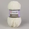 A ball of cream-colored yarn with a label around it. Náhľad obrázku produktu