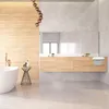 A modern bathroom with a bathtub, vanity, and mirror. Produktbild-Vorschau