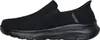 A black Skechers slip-on shoe is shown from the side against a white background. Voir les images du produit