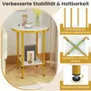 A round side table with a marble-look top and gold legs, shown in a room setting with decorative items on top and books on the lower shelf. The image also includes callouts highlighting product features. Náhľad obrázku produktu