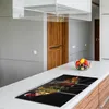 A modern kitchen counter with a glass stovetop cover featuring an image of spices on spoons. Náhľad obrázku produktu