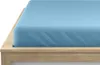 A close-up view of a light blue fitted sheet on a wooden bed frame. Náhled obrázku produktu
