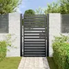 A black metal garden gate with horizontal slats, set within a white brick wall and surrounded by greenery. Náhled obrázku produktu