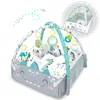 A baby play mat with arches and hanging toys, featuring a dinosaur theme. A smaller inset image shows a different configuration of the play mat. Anteprima dell’immagine prodotto
