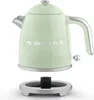 A light green electric kettle and its power base are shown against a white background. Voir les images du produit