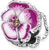 A close-up studio shot of a Pandora charm shaped like a purple and white pansy flower, adorned with small clear crystals along its edges and a small orange gem in the center. Produktbild-Vorschau