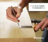 A person is using a marking tool on a wooden surface. Produktbild-Vorschau