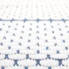 A close-up, abstract view of a white acupressure mat with a blue background. Produktbild-Vorschau