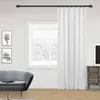 A living room scene with a sofa, a window with curtains, and artwork on the wall. Produktbild-Vorschau