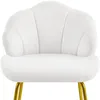 A white upholstered chair with gold legs. Produktbild-Vorschau