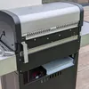 A close-up view of a gas grill. Anteprima dell’immagine prodotto