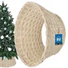 A Christmas tree with ornaments and a wicker tree skirt. Náhľad obrázku produktu