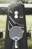 A close-up of a table tennis paddle and balls stored on a table tennis table. Produktbild-Vorschau