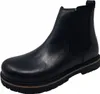 A black leather Chelsea boot with a thick sole is shown against a white background. Anteprima dell’immagine prodotto