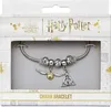 A Harry Potter charm bracelet displayed in its retail packaging. Podgląd zdjęcia produktu