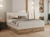 A bedroom setting with a bed as the main focus. Náhled obrázku produktu
