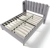 A gray upholstered bed frame with a slatted mattress support system, shown from a diagonal angle against a white background. Produktbild-Vorschau
