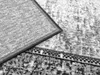 A close-up view of a rug, showing the texture and pattern of the fabric. Náhled obrázku produktu