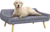 A golden retriever dog lying on a gray pet sofa with wooden legs. Produktbild-Vorschau