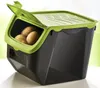 A black and green storage box for potatoes and onions, with a few potatoes visible inside. Produktbild-Vorschau