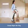 A woman is walking up a staircase while carrying a cordless vacuum cleaner. Produktbild-Vorschau