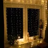 A window decorated with string lights and Christmas-themed items. Anteprima dell’immagine prodotto