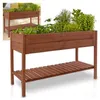 A wooden raised garden bed with plants growing in it, shown on a white background. A smaller inset image shows a similar raised garden bed on a patio. Produktbild-Vorschau