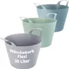 Three flexible laundry baskets in different colors are stacked on a white background. Produktbild-Vorschau