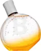A perfume bottle with a gradient of gold and clear liquid, decorated with glittery stars. Anteprima dell’immagine prodotto